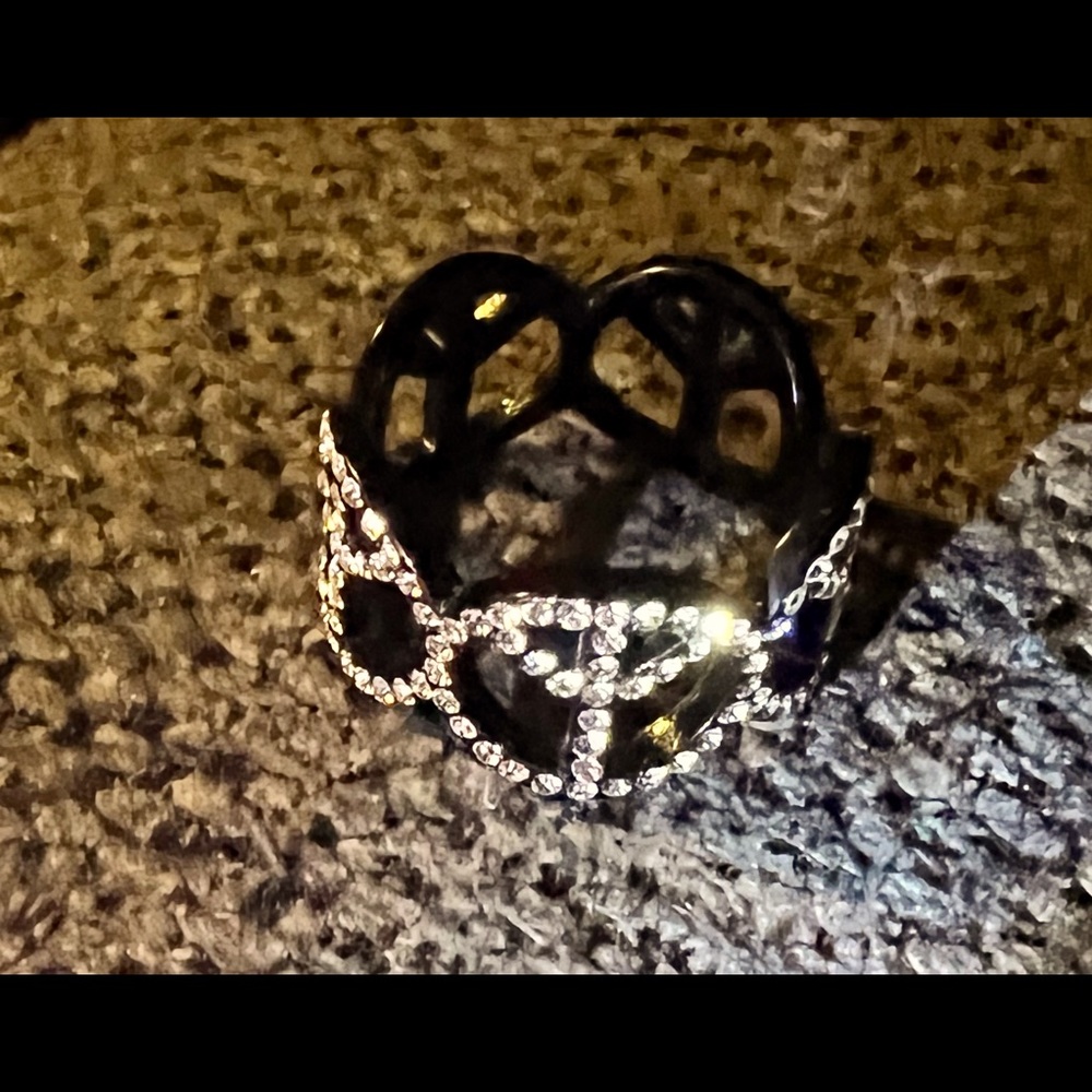 Stainless steel peace sign ring.